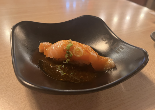 Seared salmon nigiri in a base of spicy ponzu sauce that is a sneak attack on the taste buds. Taken by Jessica Miller on April 25. 